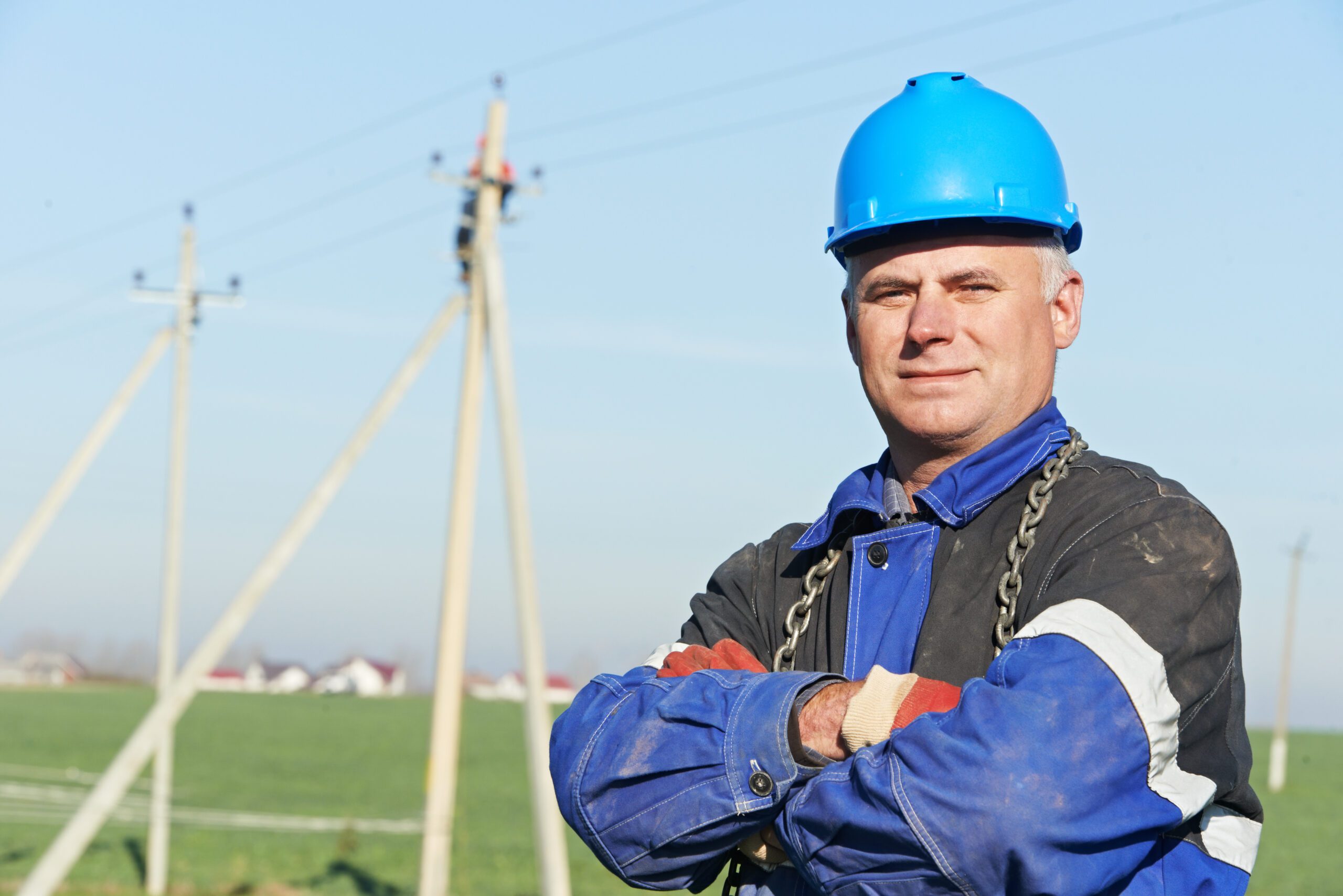 Linesman in front of utility pole